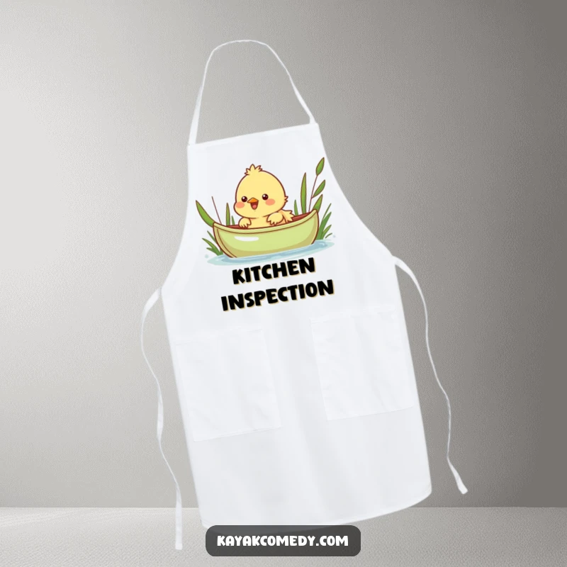 Funny Apron: A cheerful chick peeks over a green kayak, ready for kitchen fun. Perfect gift.
