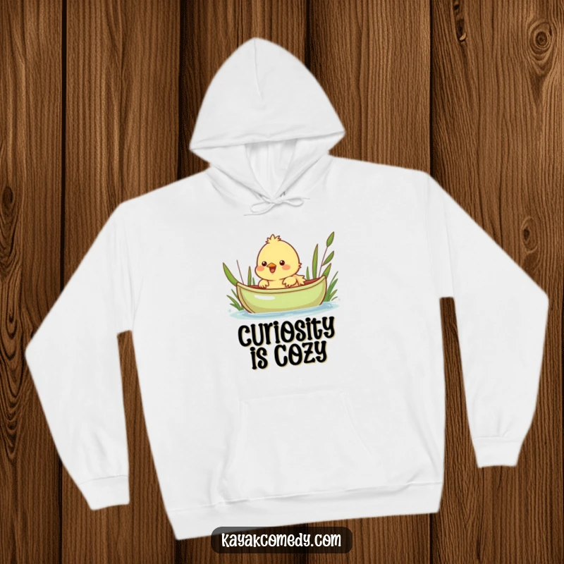 Funny Hoodie: A cheerful chick peeks over a green kayak, a symbol of curious adventure. Great gift.